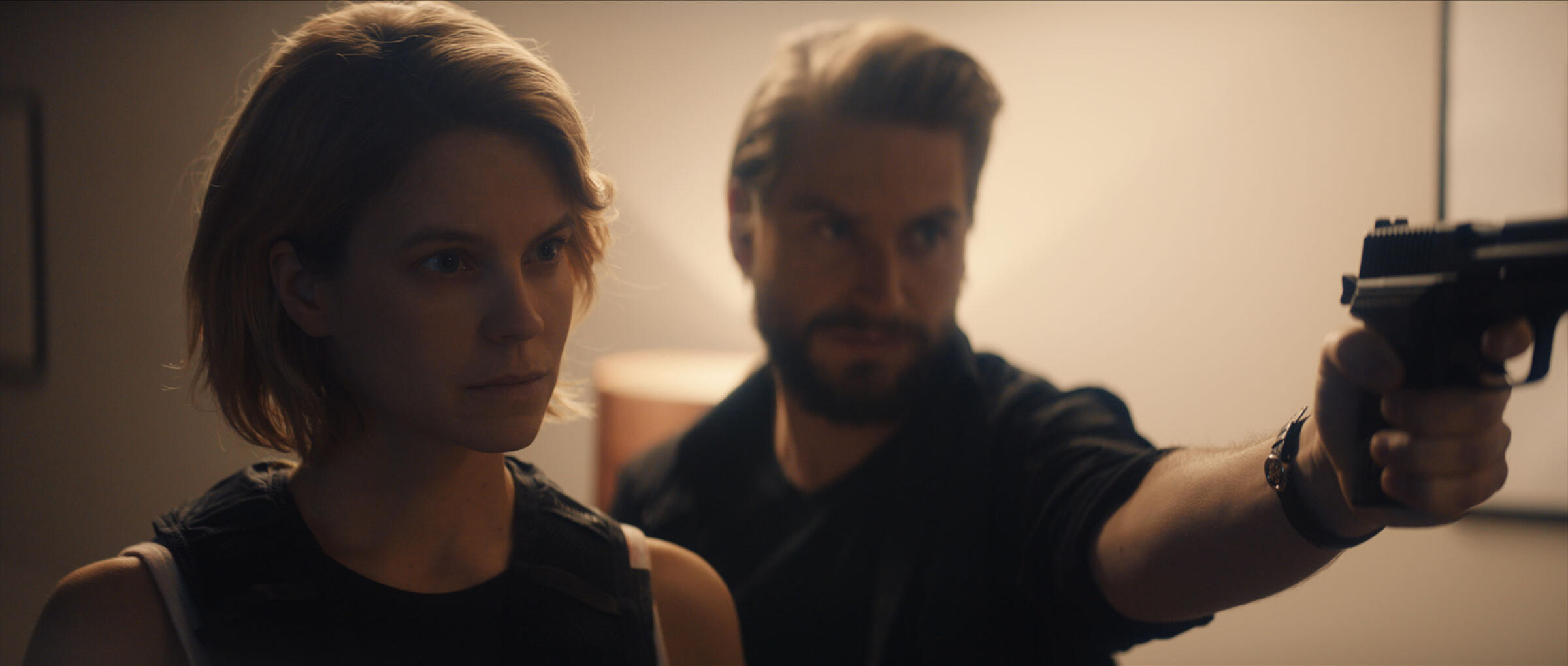 woman on angry man with weapon